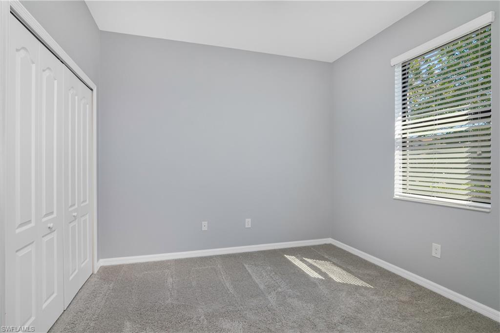 19952 Beverly Park Road Estero, FL 33928 - Photo 13 of 32 a view of an empty room with a window