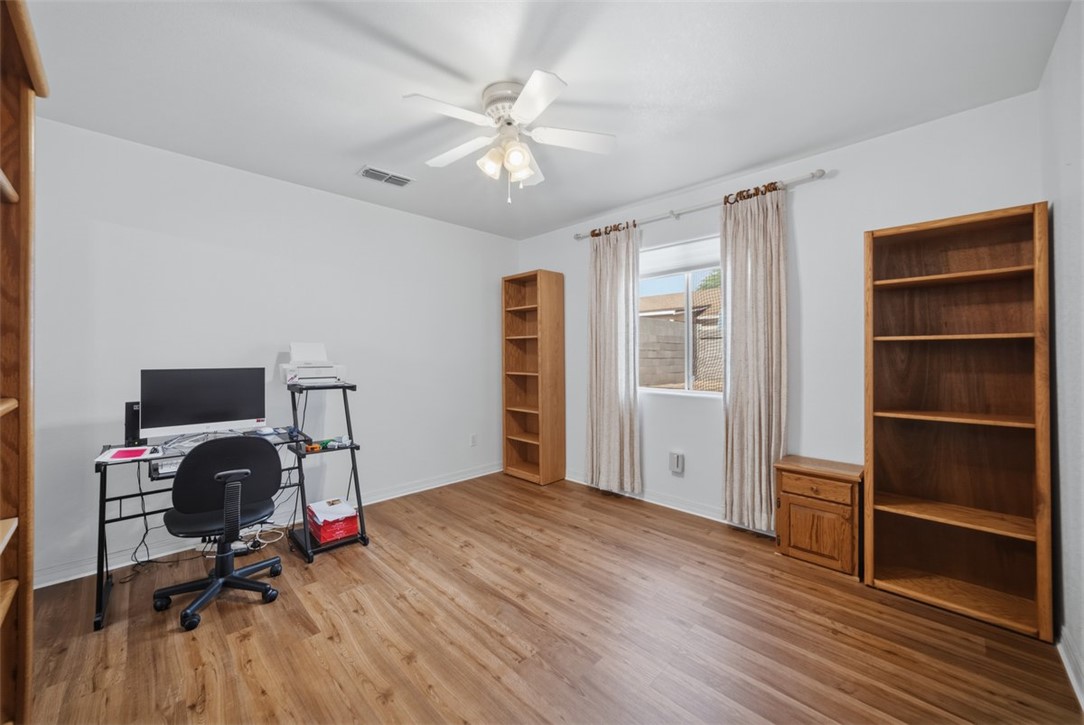 2144 Ridgeview Road Kingman, AZ 86401 - Photo 34 of 49 a view of a workspace with furniture and wooden floor