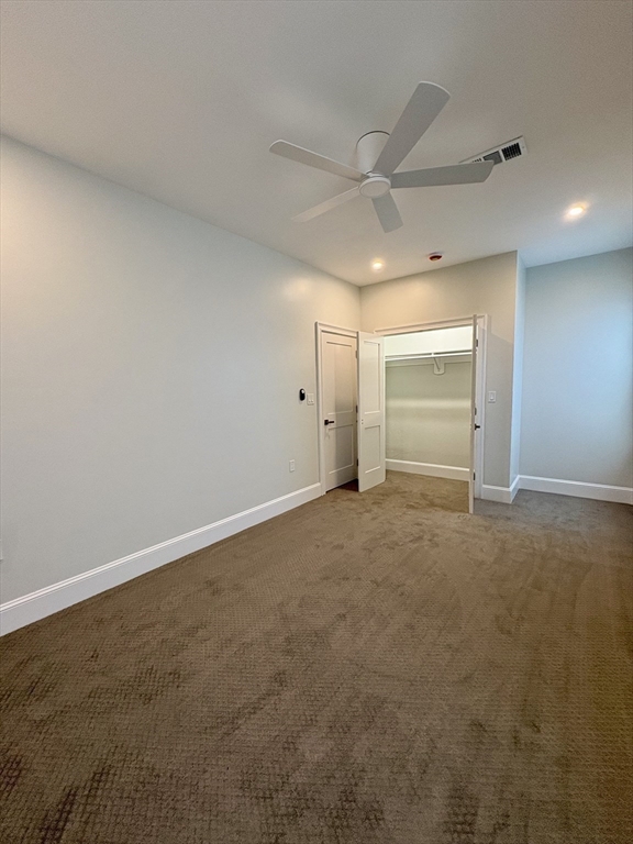54 Falcon Street, Unit 54 Boston, MA 02128 - Photo 12 of 19 an empty room with an empty space and wooden floor