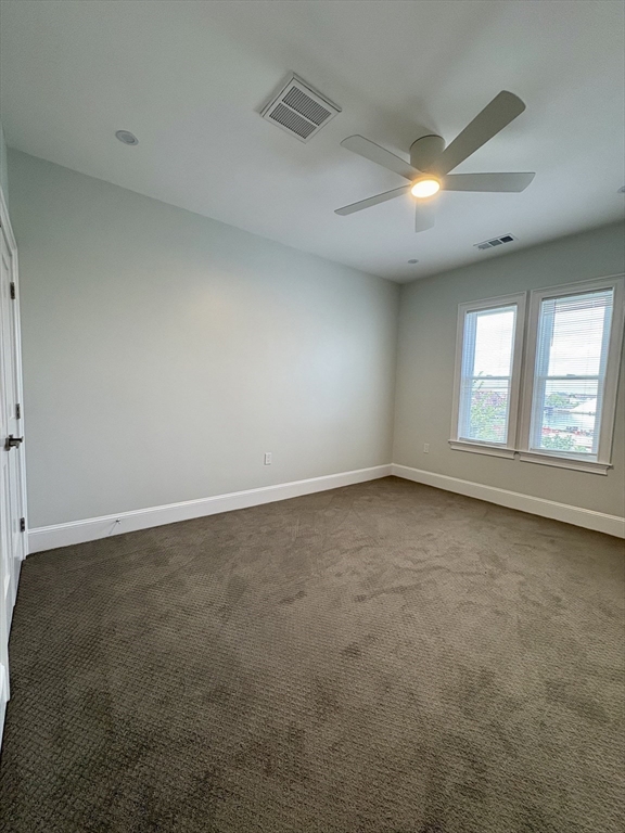 54 Falcon Street, Unit 54 Boston, MA 02128 - Photo 9 of 19 an empty room with a empty space and windows
