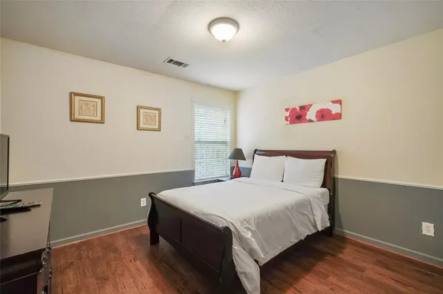 a bedroom with a bed and a table