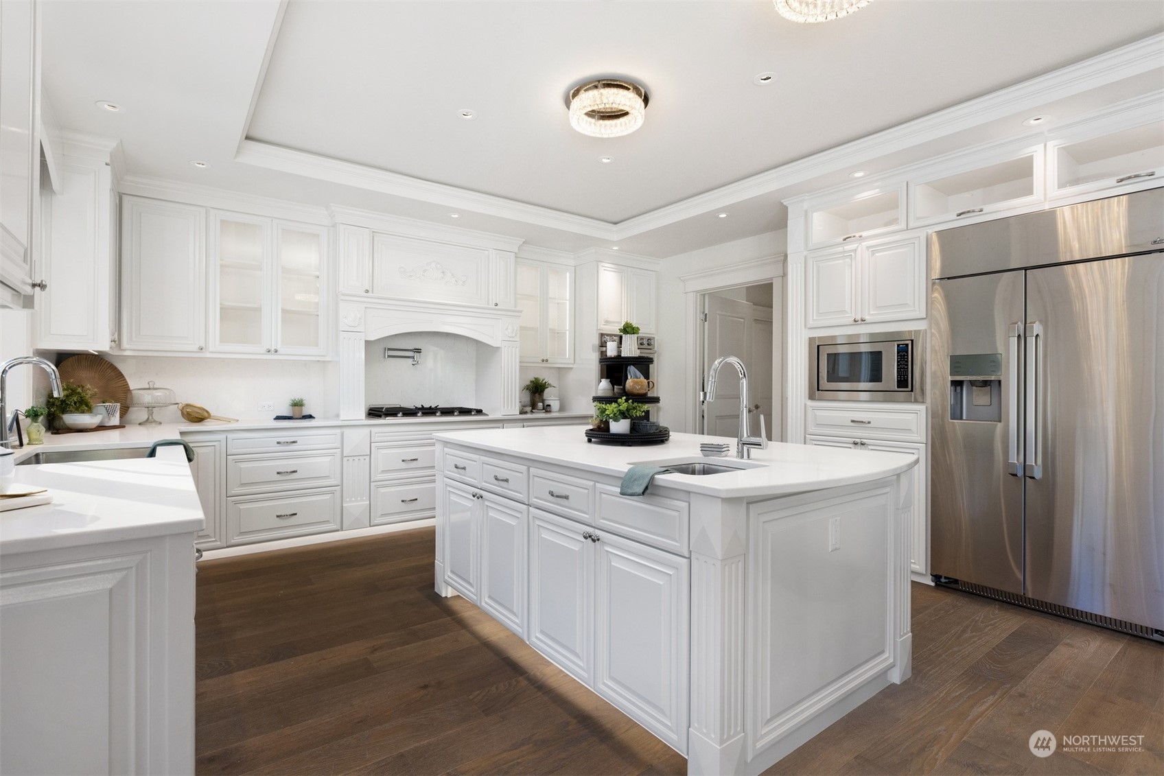 627 Linden Road Bellingham, WA 98225 - Photo 12 of 40 a kitchen with white cabinets and stainless steel appliances