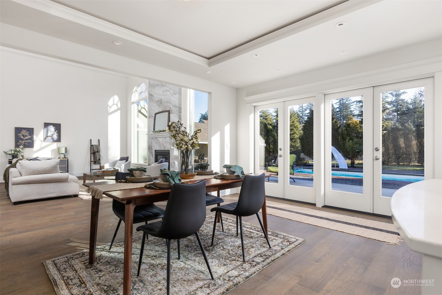 627 Linden Road Bellingham, WA 98225 - Photo 14 of 40 a view of a dining room with furniture wooden floor and a chandelier