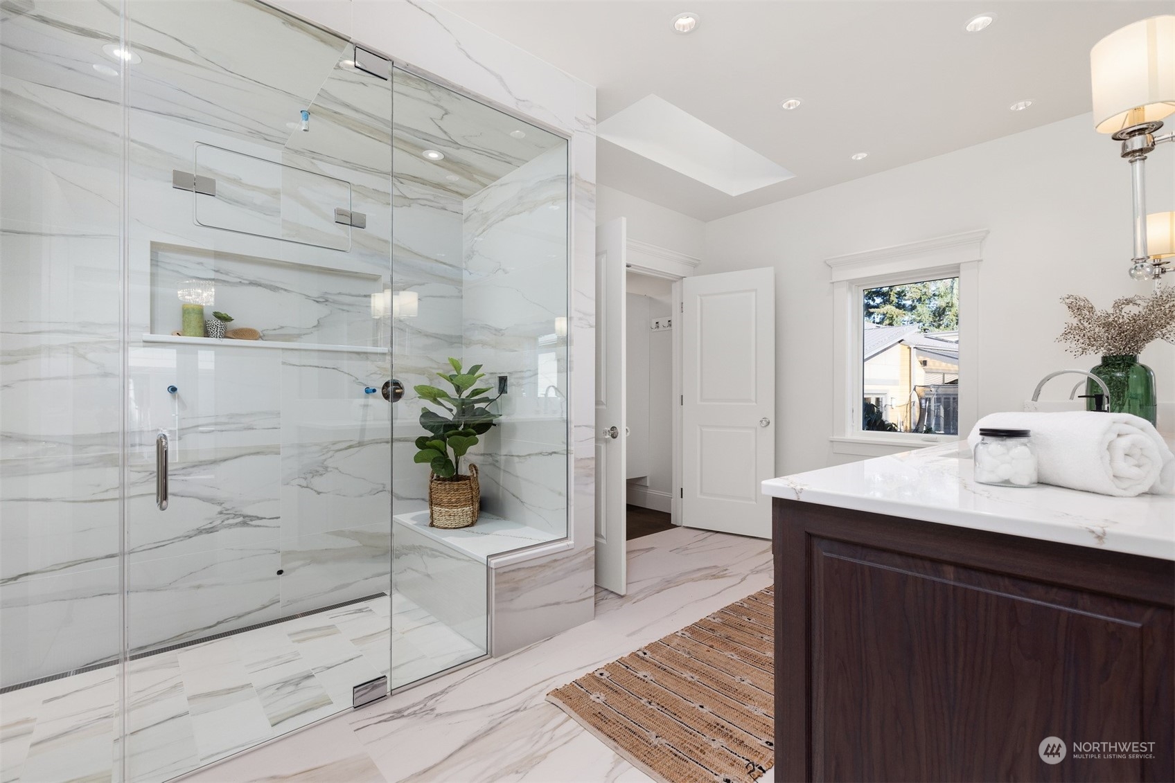 627 Linden Road Bellingham, WA 98225 - Photo 21 of 40 a bathroom with a sink a mirror and a shower