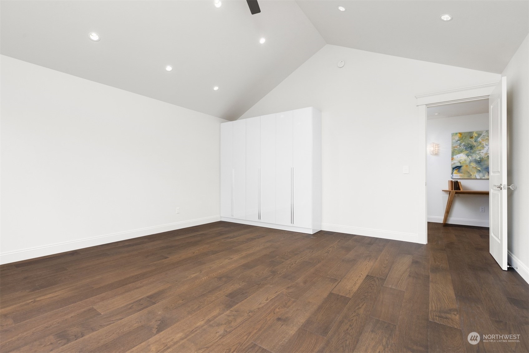 627 Linden Road Bellingham, WA 98225 - Photo 28 of 40 an empty room with wooden floor and a corridor