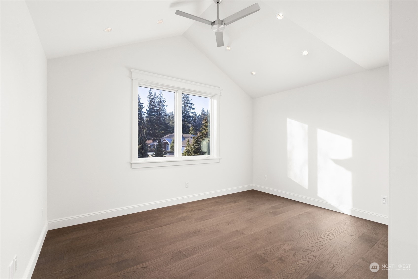 627 Linden Road Bellingham, WA 98225 - Photo 30 of 40 an empty room with wooden floor and windows