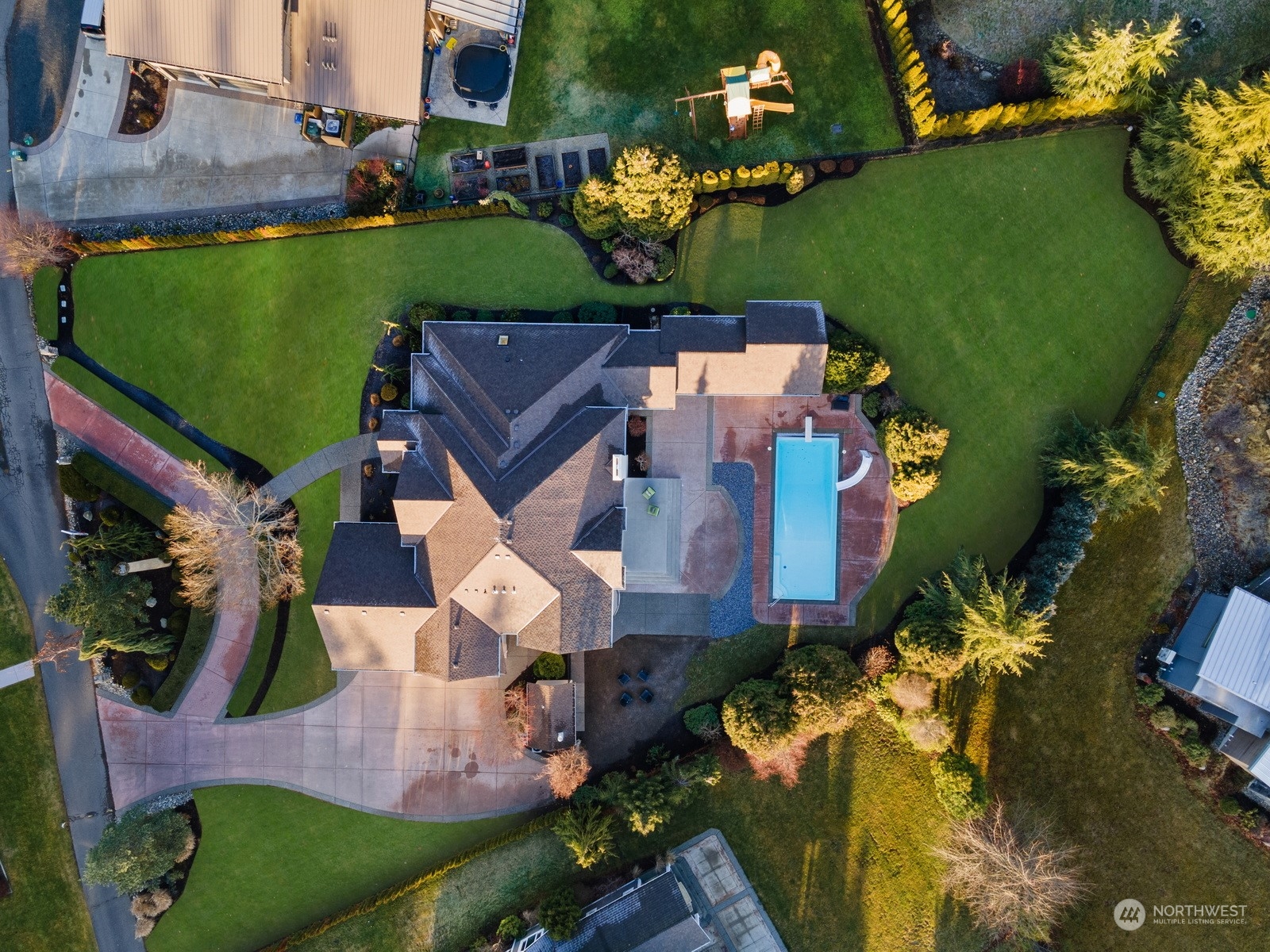 627 Linden Road Bellingham, WA 98225 - Photo 39 of 40 an aerial view of a house with a garden and swimming pool