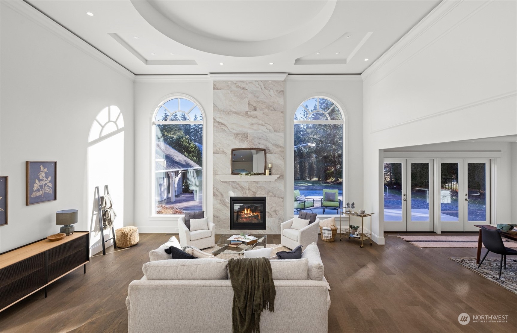 627 Linden Road Bellingham, WA 98225 - Photo 4 of 40 a living room with furniture a fireplace and a chandelier