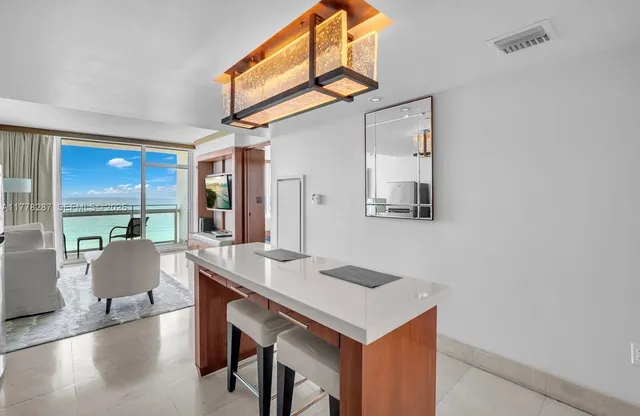a view of kitchen island with furniture and wooden floor