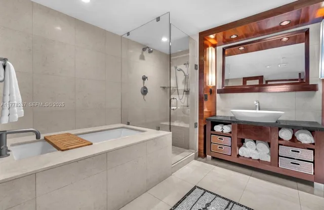 a bathroom with a sink a vanity and a mirror