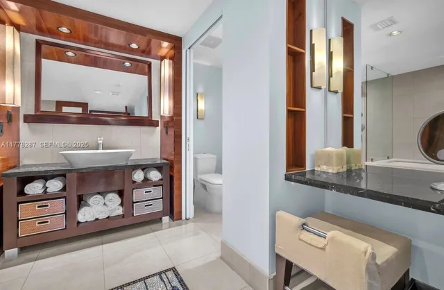 a bathroom with a double vanity sink and a mirror