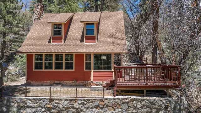 a view of a house with a yard and large window