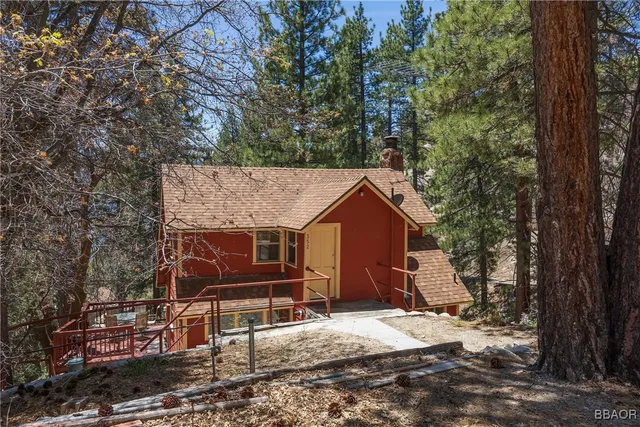 a backyard of a house with barbeque oven