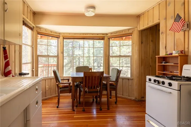 a room with refrigerator a washer and dryer next to a window