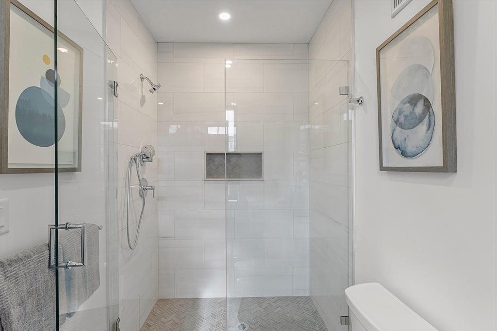 12 Guild Road, Unit 12 Needham, MA 02494 - Photo 14 of 32 a bathroom with a shower and toilet