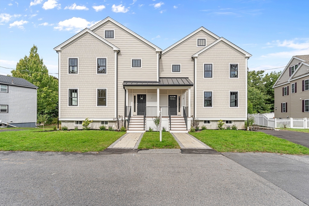 12 Guild Road, Unit 12 Needham, MA 02494 - Photo 2 of 32 front view of a house with a yard