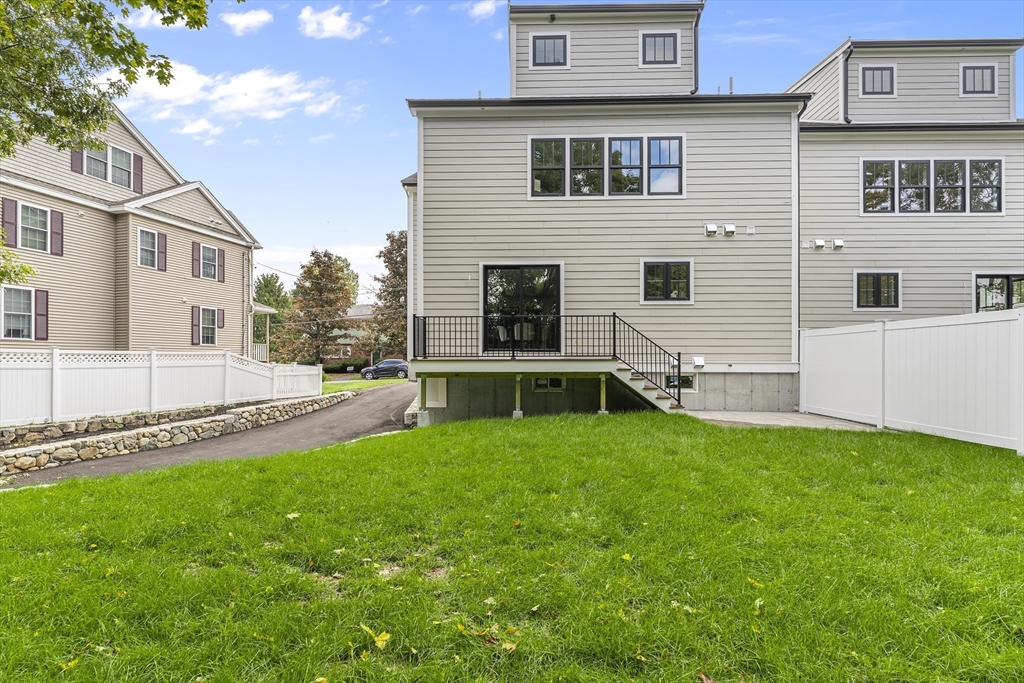 12 Guild Road, Unit 12 Needham, MA 02494 - Photo 29 of 32 a view of a house with a yard and sitting area