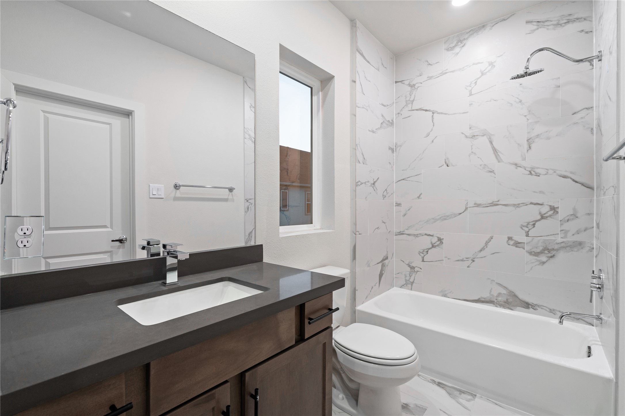 6451 Rena Street Houston, TX 77092 - Photo 28 of 33 Alternate bathroom color palette displayed here reflects the selection options available, allowing buyers to choose a style that fits their preference.