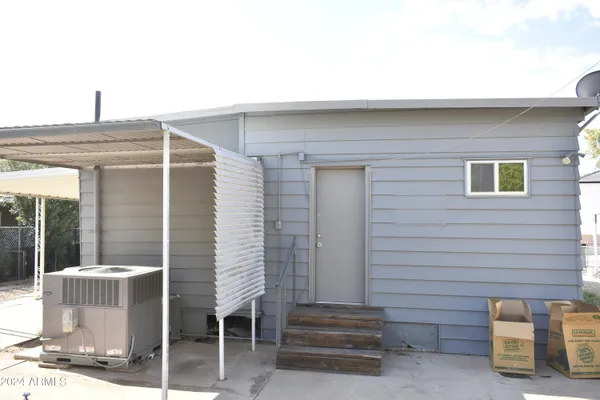 a view of backyard with outdoor seating