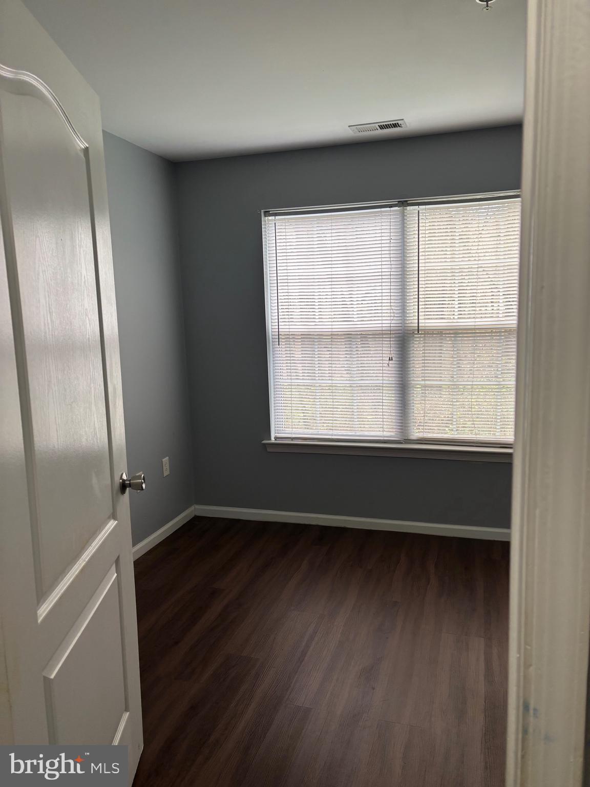 127 Natalie Road Riverside, NJ 08075 - Photo 11 of 18 a view of an empty room with wooden floor and a window