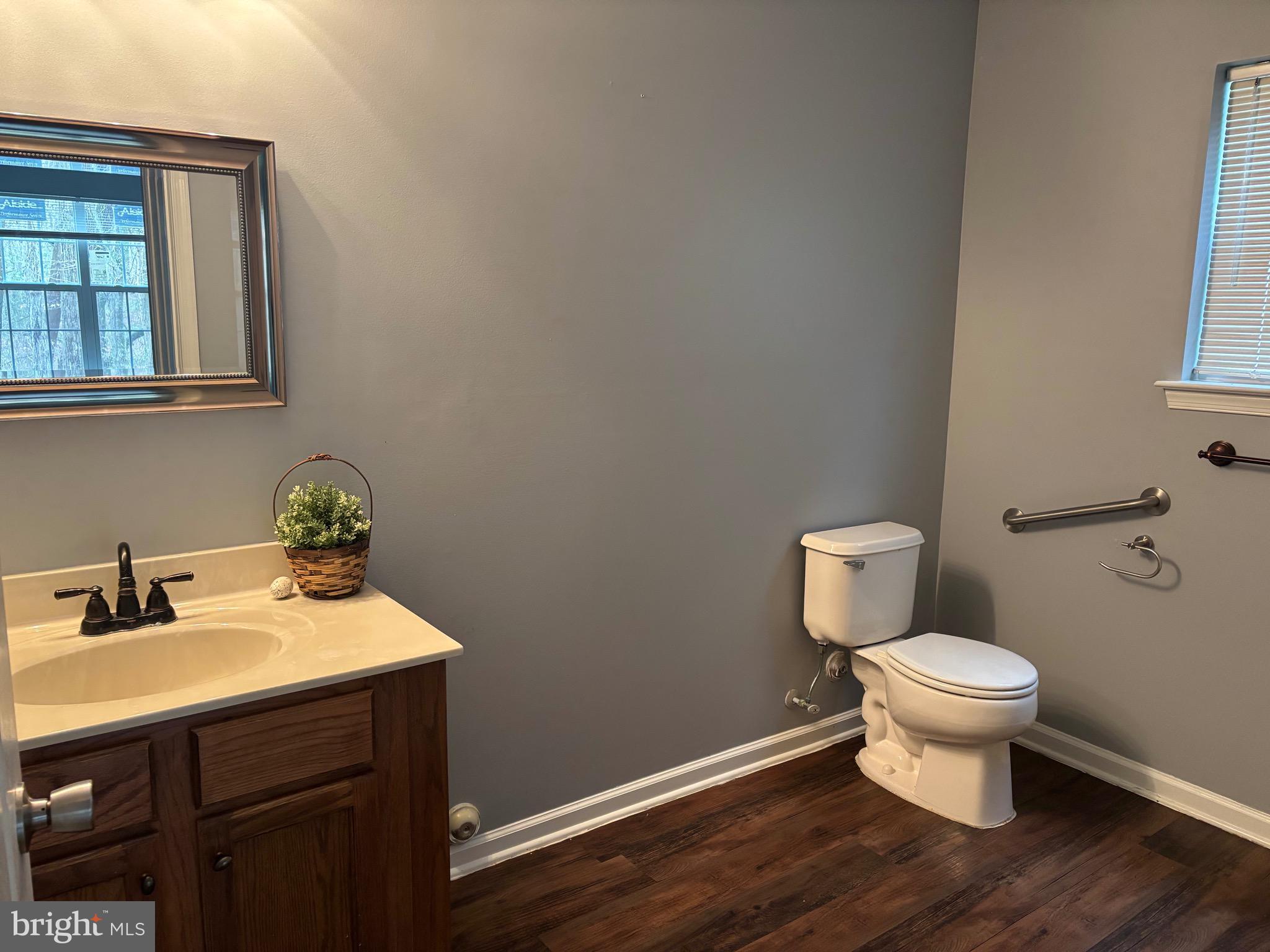 127 Natalie Road Riverside, NJ 08075 - Photo 14 of 18 a bathroom with a sink toilet and a window