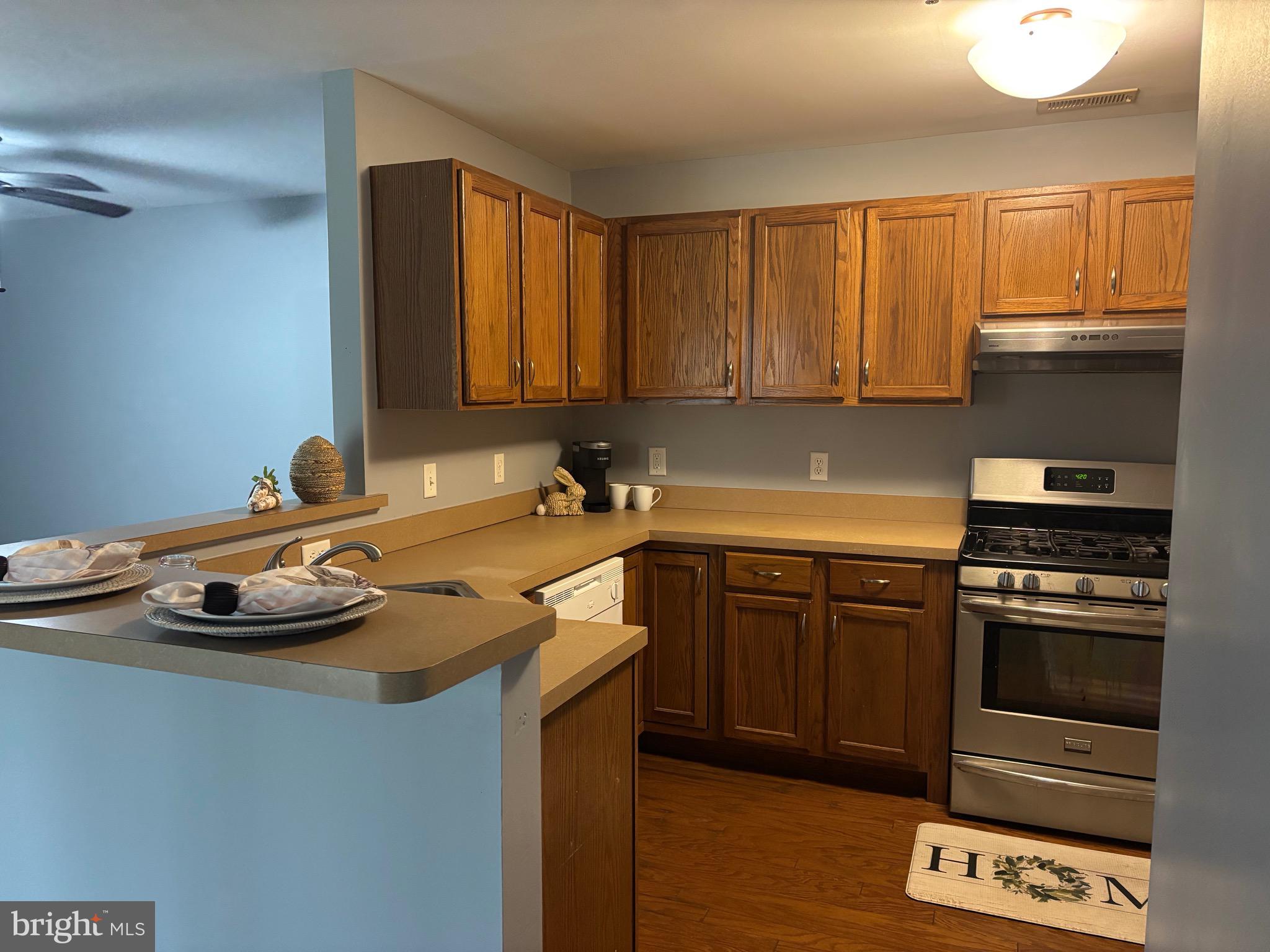 127 Natalie Road Riverside, NJ 08075 - Photo 7 of 18 a kitchen with a stove a sink and cabinets