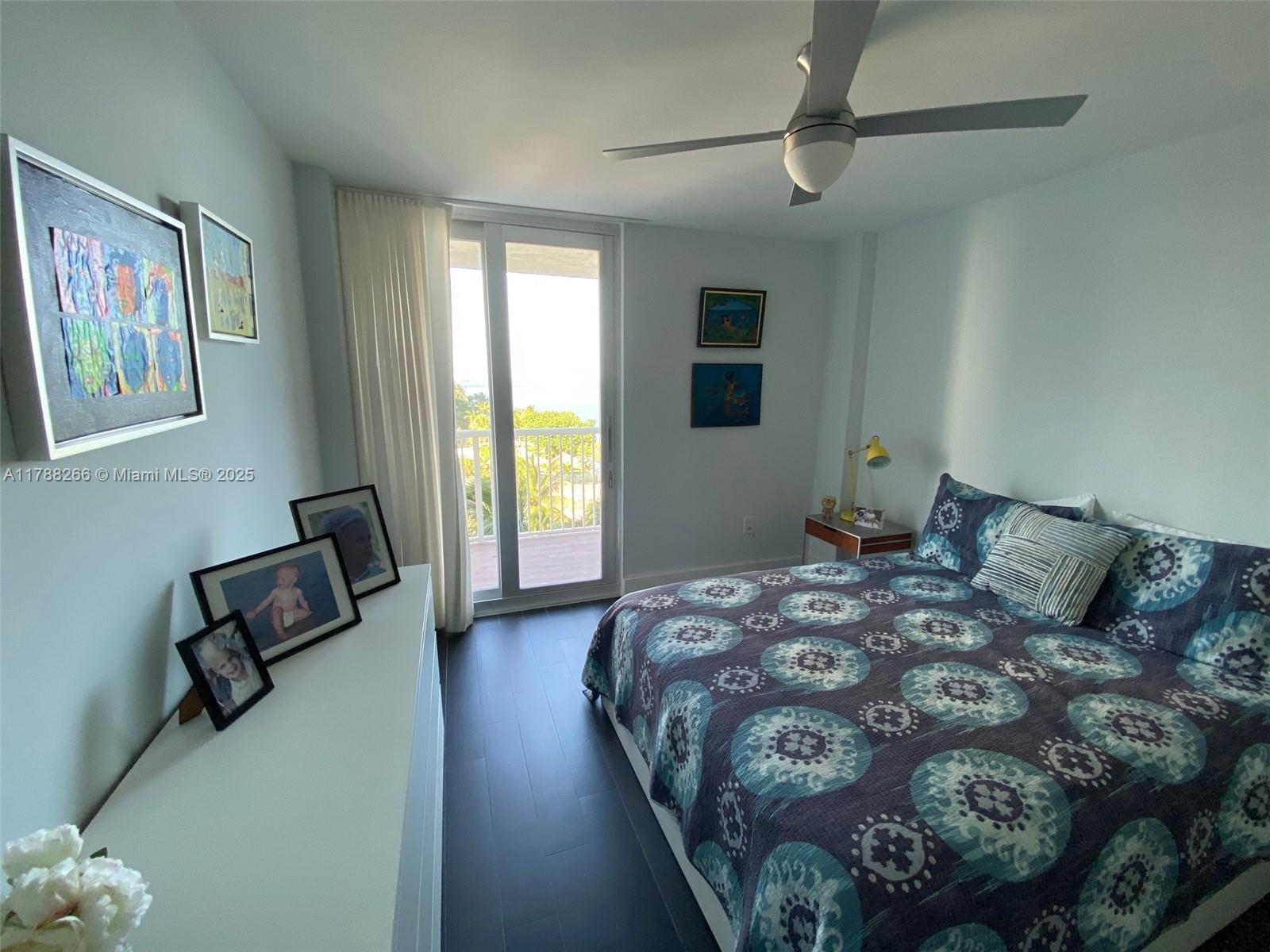 150 Southeast 25th Road, Unit 7A Miami, FL 33129 - Photo 11 of 18 a bed sitting in a spacious bedroom next to a window