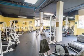 150 Southeast 25th Road, Unit 7A Miami, FL 33129 - Photo 16 of 18 a room with gym equipment