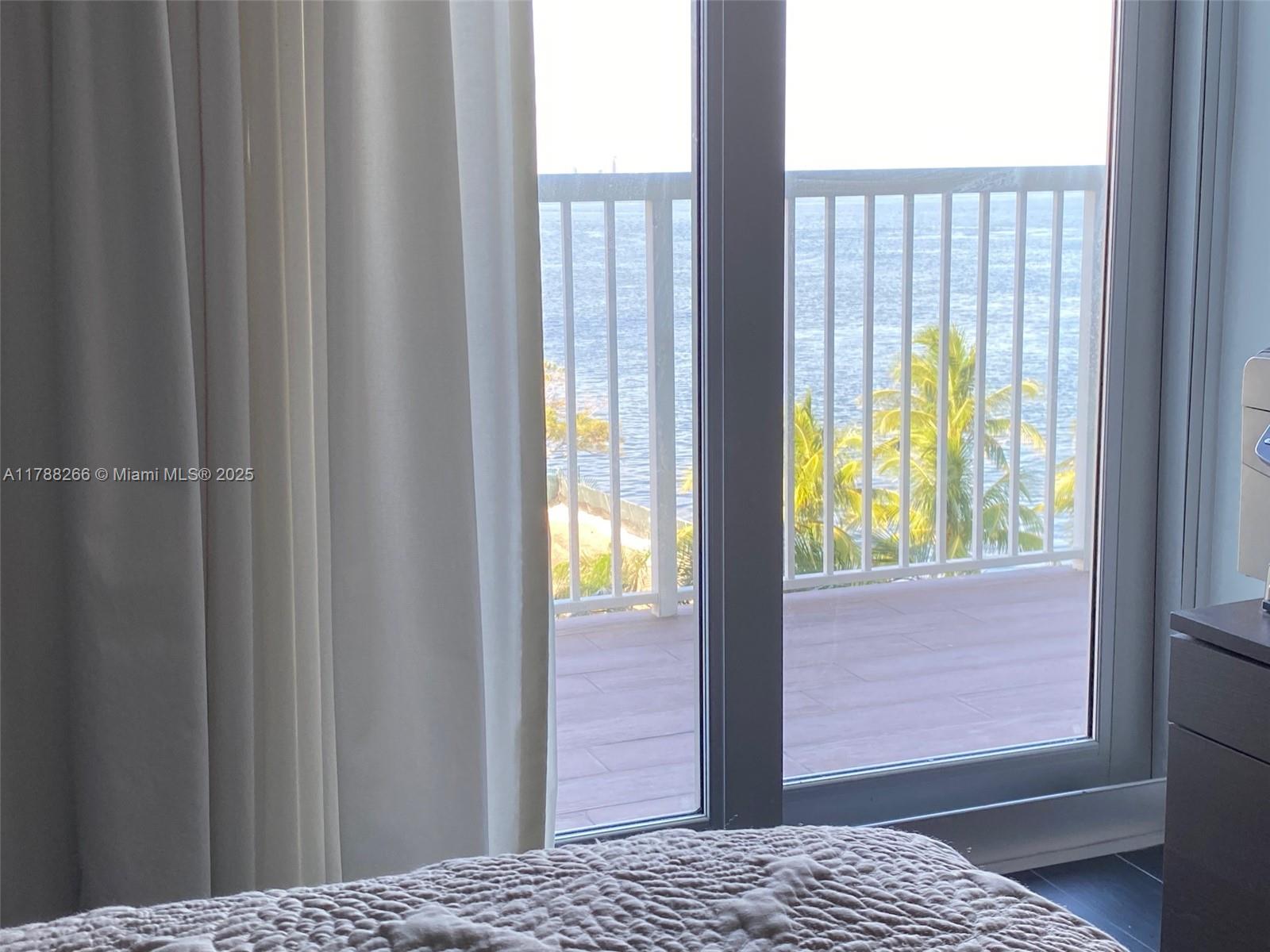 150 Southeast 25th Road, Unit 7A Miami, FL 33129 - Photo 10 of 18 a view of bedroom and window