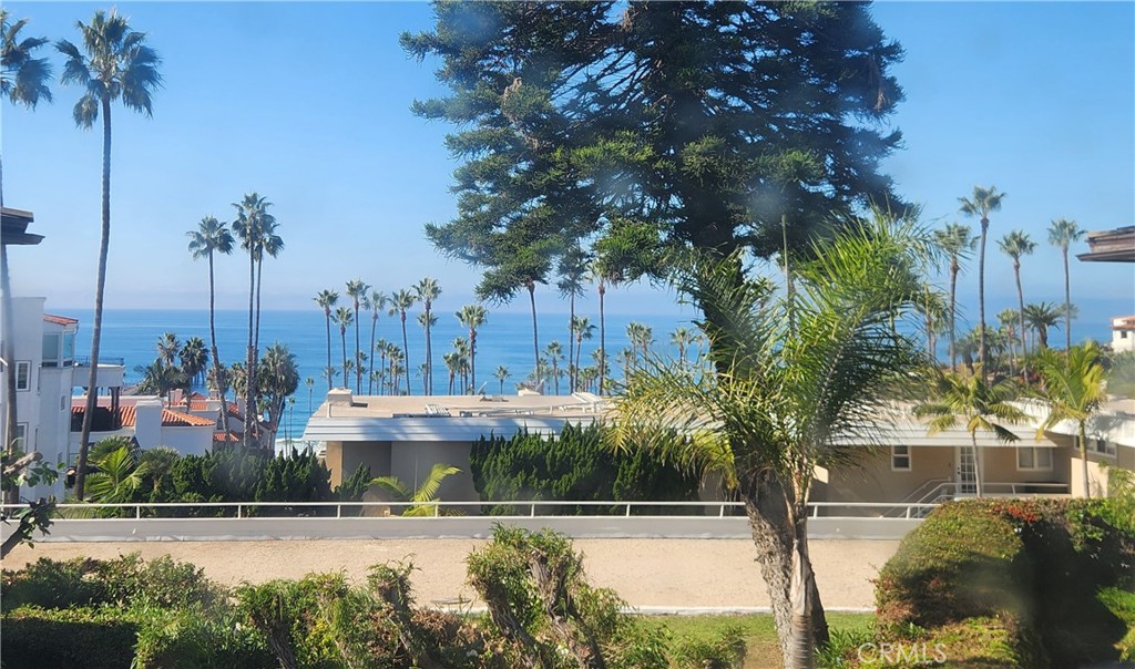 418 Avenida Santa Barbara, Unit B San Clemente, CA 92672 - Photo 1 of 52 a view of a swimming pool and a terrace