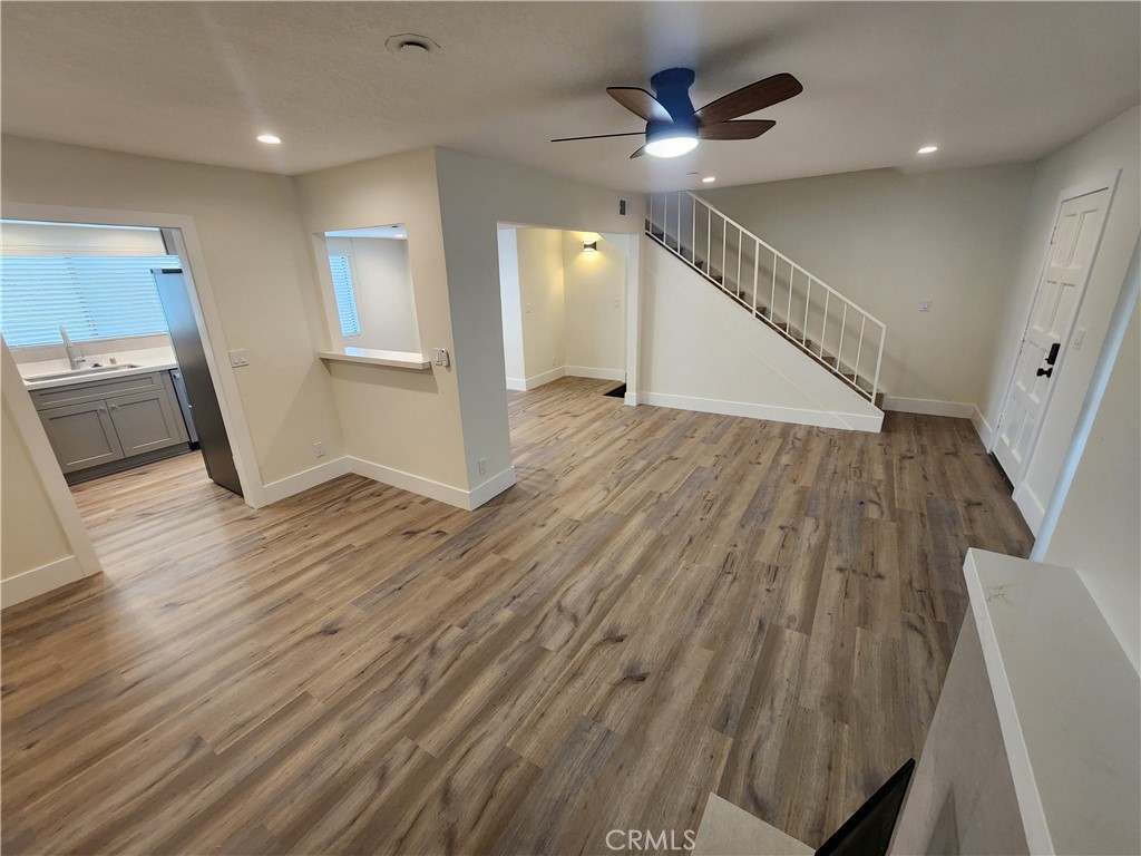 418 Avenida Santa Barbara, Unit B San Clemente, CA 92672 - Photo 21 of 52 wooden floor in an empty room with a window