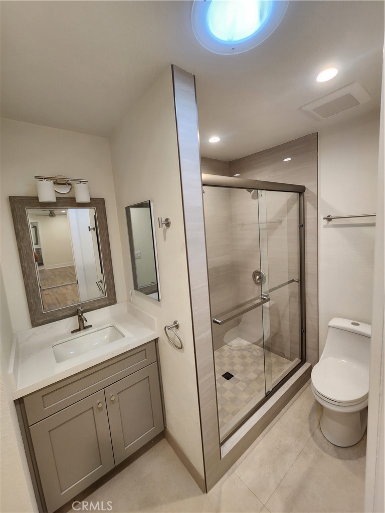 418 Avenida Santa Barbara, Unit B San Clemente, CA 92672 - Photo 33 of 52 a bathroom with a double vanity sink toilet and shower