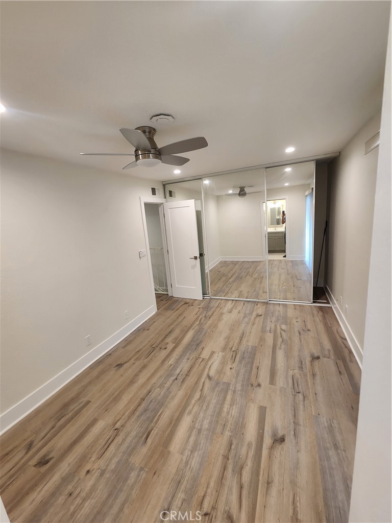 418 Avenida Santa Barbara, Unit B San Clemente, CA 92672 - Photo 37 of 52 a view of empty room with wooden floor