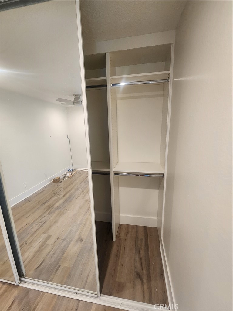 418 Avenida Santa Barbara, Unit B San Clemente, CA 92672 - Photo 39 of 52 a view of a room with wooden floor