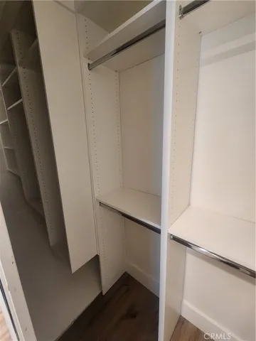 a view of an empty walk in closet