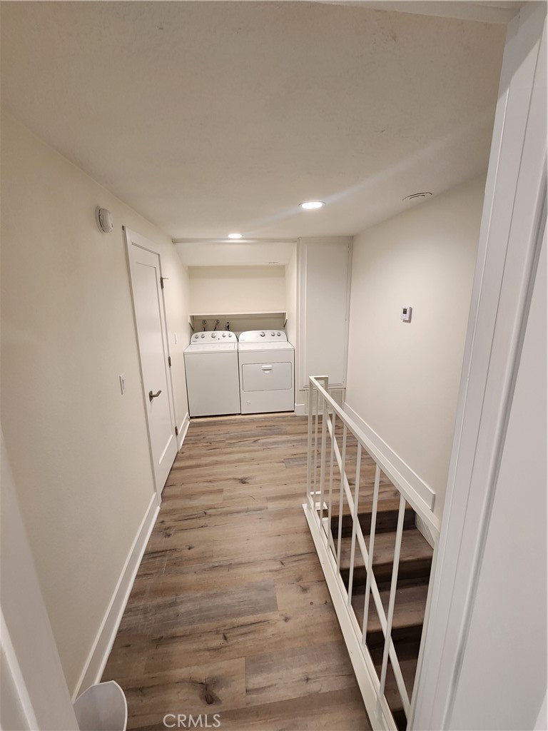 418 Avenida Santa Barbara, Unit B San Clemente, CA 92672 - Photo 43 of 52 a view of a hallway with wooden floor