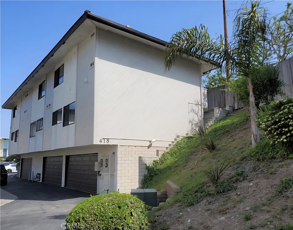 418 Avenida Santa Barbara, Unit B San Clemente, CA 92672 - Photo 47 of 52 a house with a yard
