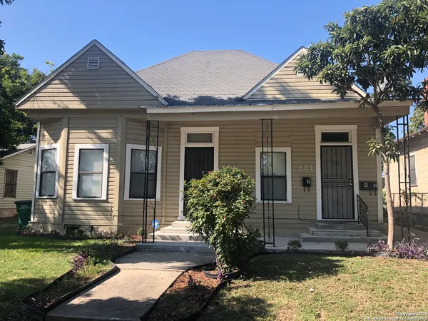 front view of a house with a yard