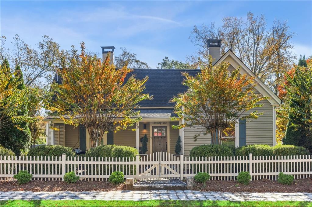 29 Sessions Street Northwest Marietta, GA 30060 - Photo 1 of 39 a front view of a house with a garden and a tree