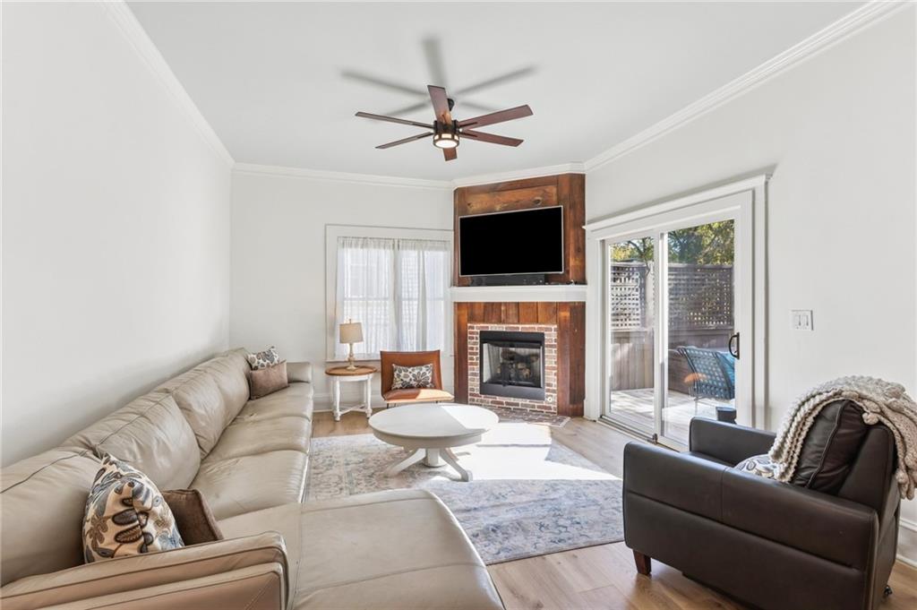 29 Sessions Street Northwest Marietta, GA 30060 - Photo 11 of 39 a living room with furniture a fireplace and a flat screen tv