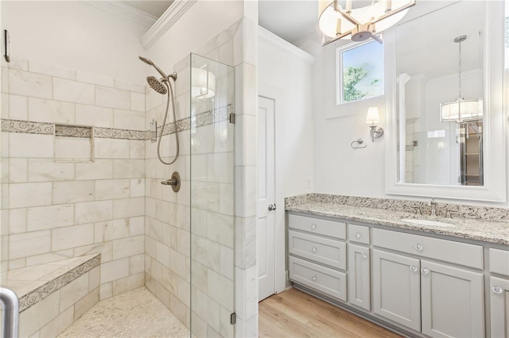 29 Sessions Street Northwest Marietta, GA 30060 - Photo 14 of 39 a bathroom with a granite countertop sink a mirror and shower