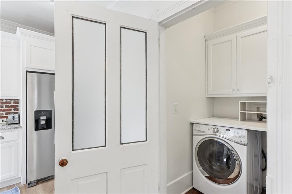 29 Sessions Street Northwest Marietta, GA 30060 - Photo 23 of 39 a view of a hallway with washer and dryer