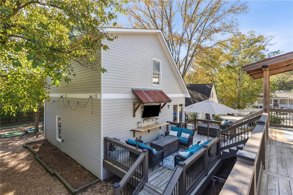 29 Sessions Street Northwest Marietta, GA 30060 - Photo 28 of 39 a view of a chairs and table on the wooden deck