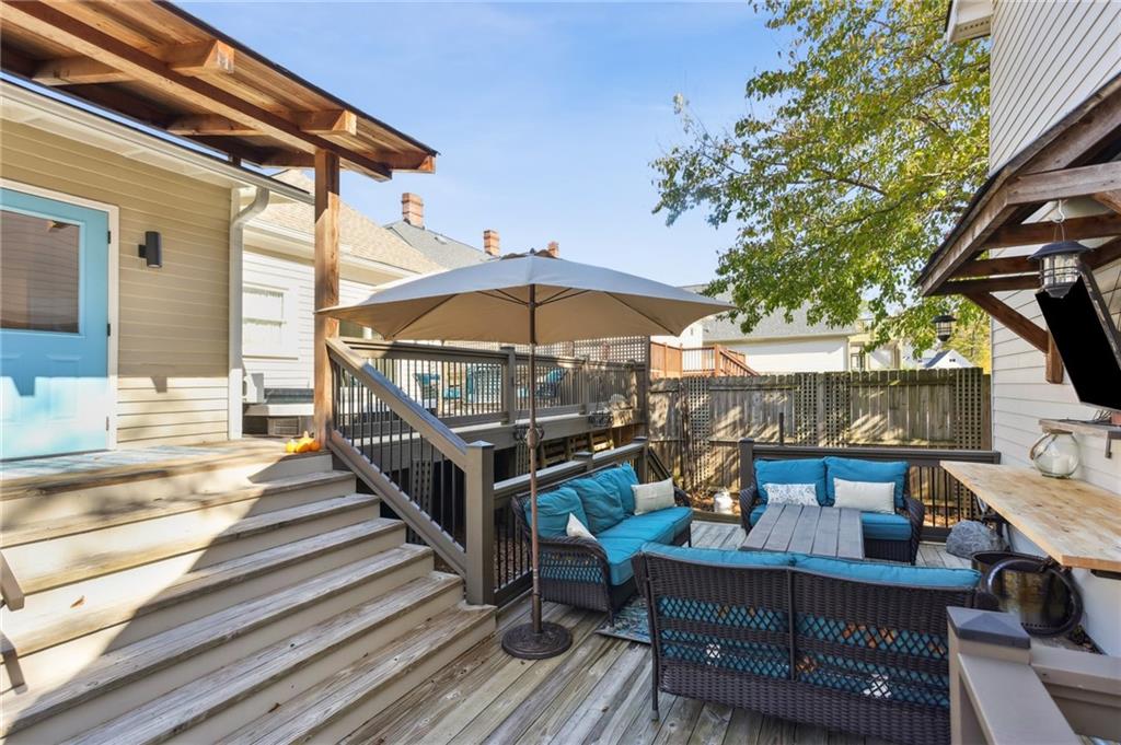 29 Sessions Street Northwest Marietta, GA 30060 - Photo 29 of 39 a view of a house with wooden deck and furniture