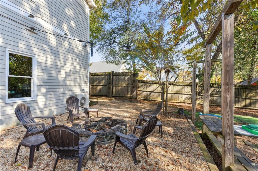 29 Sessions Street Northwest Marietta, GA 30060 - Photo 30 of 39 a backyard of a house with table and chairs