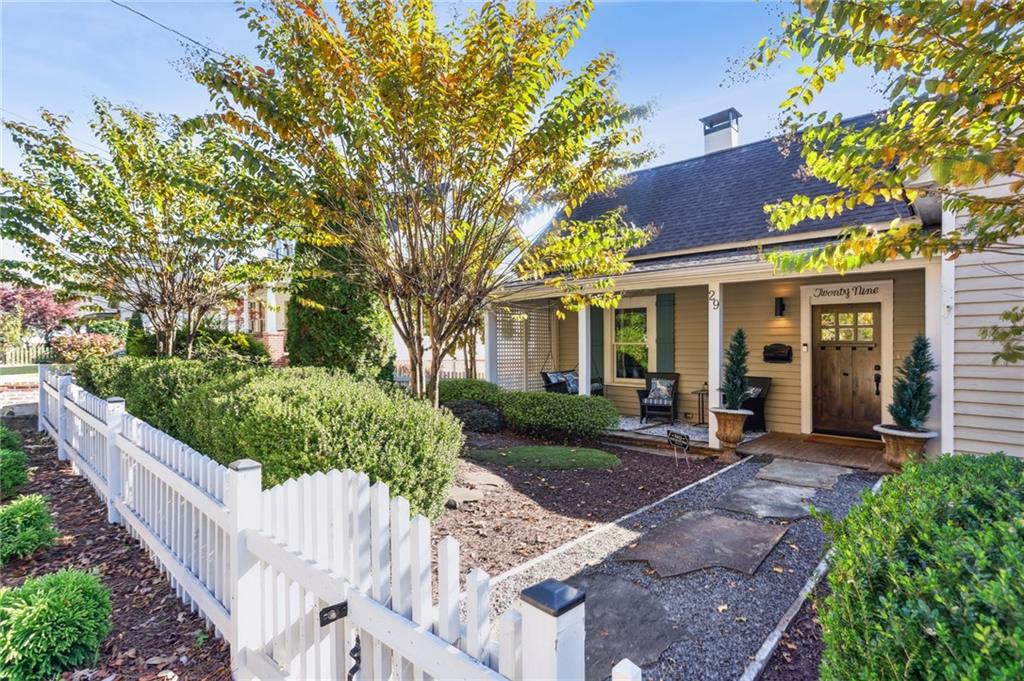 29 Sessions Street Northwest Marietta, GA 30060 - Photo 3 of 39 a front view of a house with a yard