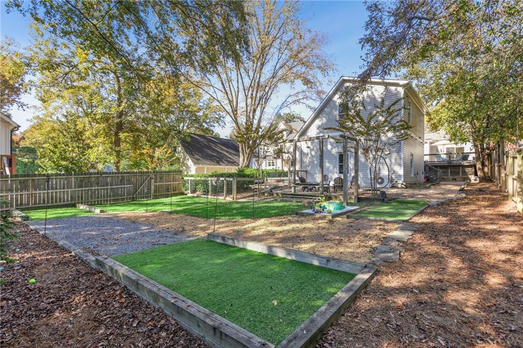 29 Sessions Street Northwest Marietta, GA 30060 - Photo 33 of 39 a view of a yard with a house
