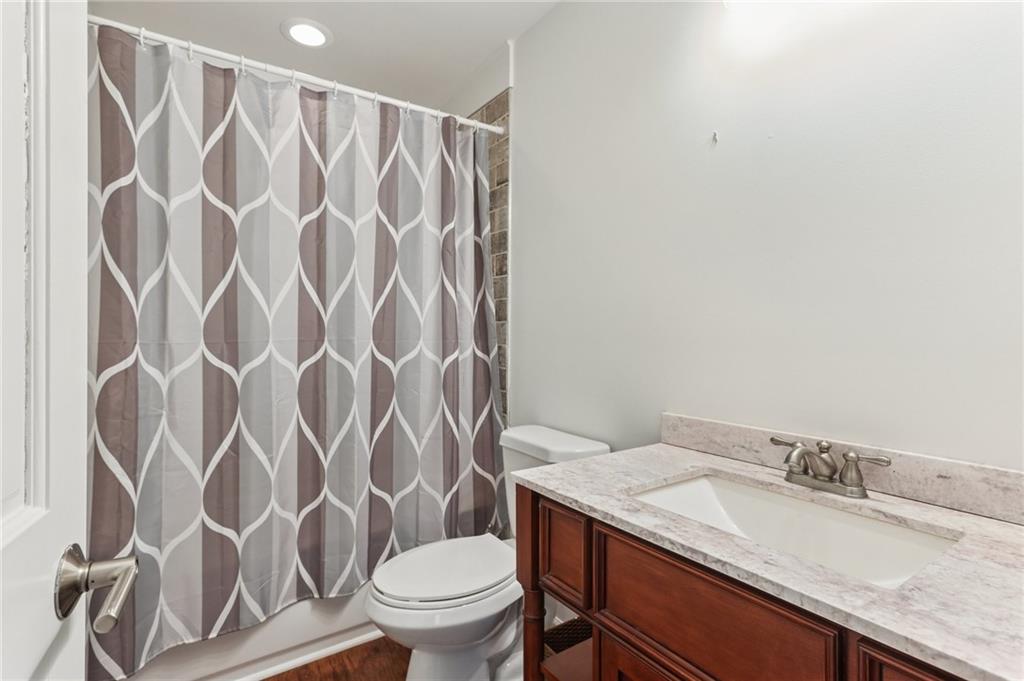 29 Sessions Street Northwest Marietta, GA 30060 - Photo 36 of 39 a bathroom with a granite countertop sink and a toilet