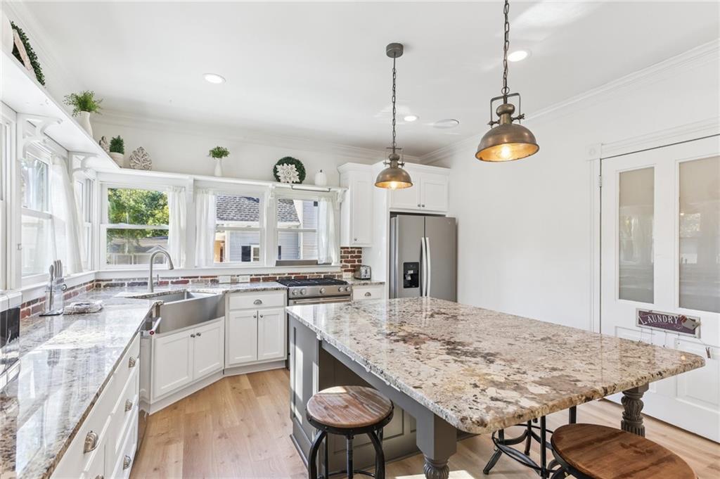 29 Sessions Street Northwest Marietta, GA 30060 - Photo 7 of 39 a kitchen with center island and stainless steel appliances