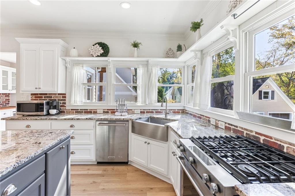 29 Sessions Street Northwest Marietta, GA 30060 - Photo 9 of 39 a large kitchen with granite countertop a stove and a sink